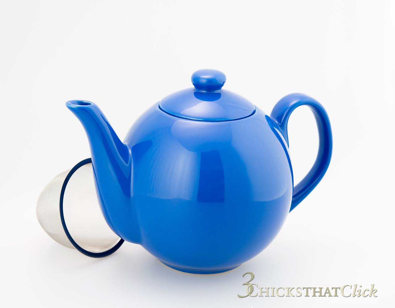 Photo of a blue teapot with tea filter