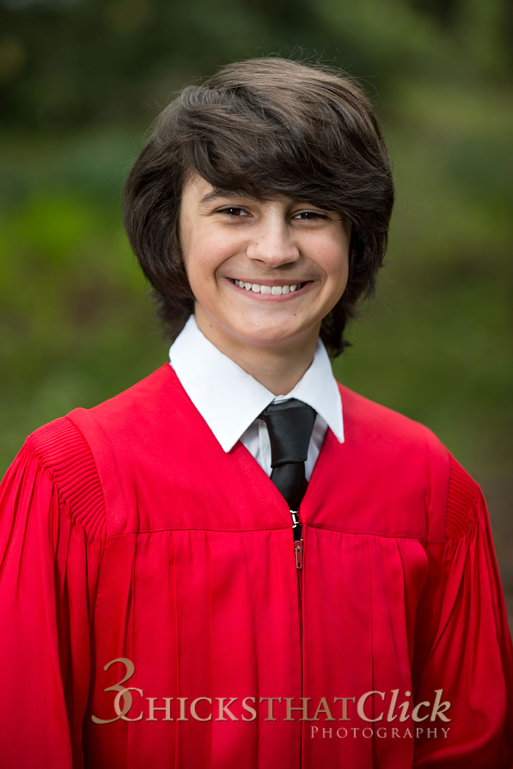 Photo of young man in red Confirmation gown